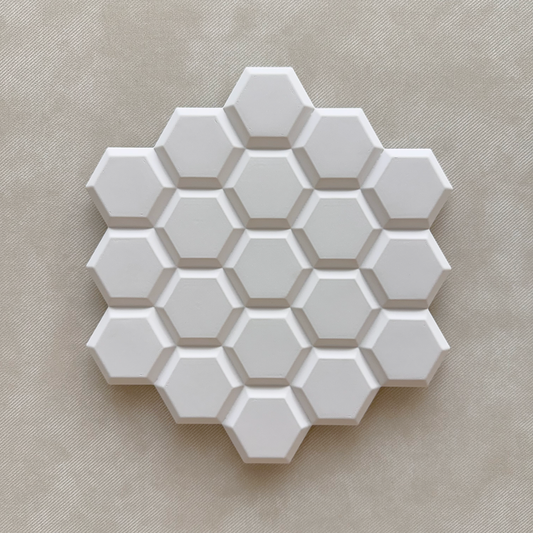 Textured honeycomb pattern casting in natural light

